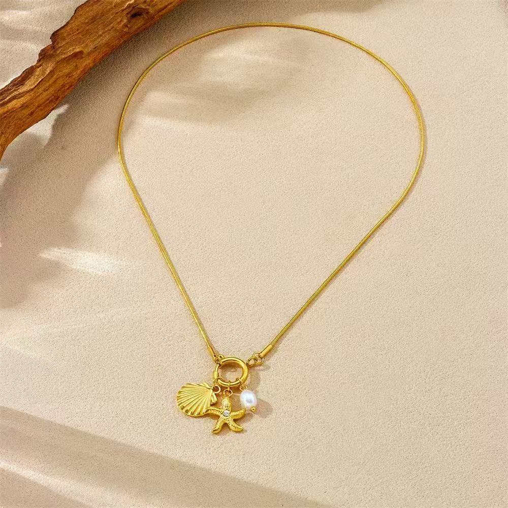 Marine Treasure Necklace Shell and Star Charms in Steel