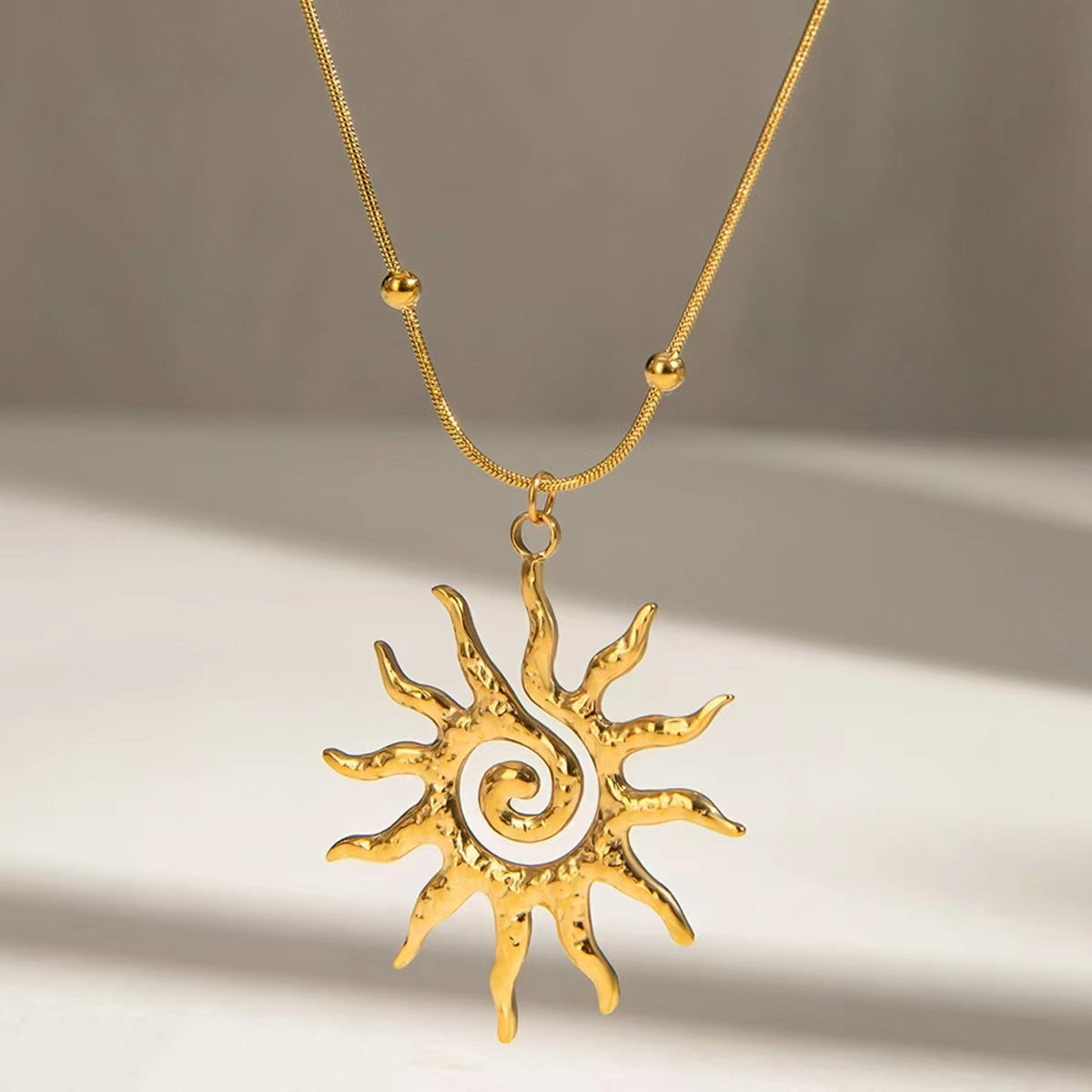 Golden Spiral Sun Necklace in Stainless Steel