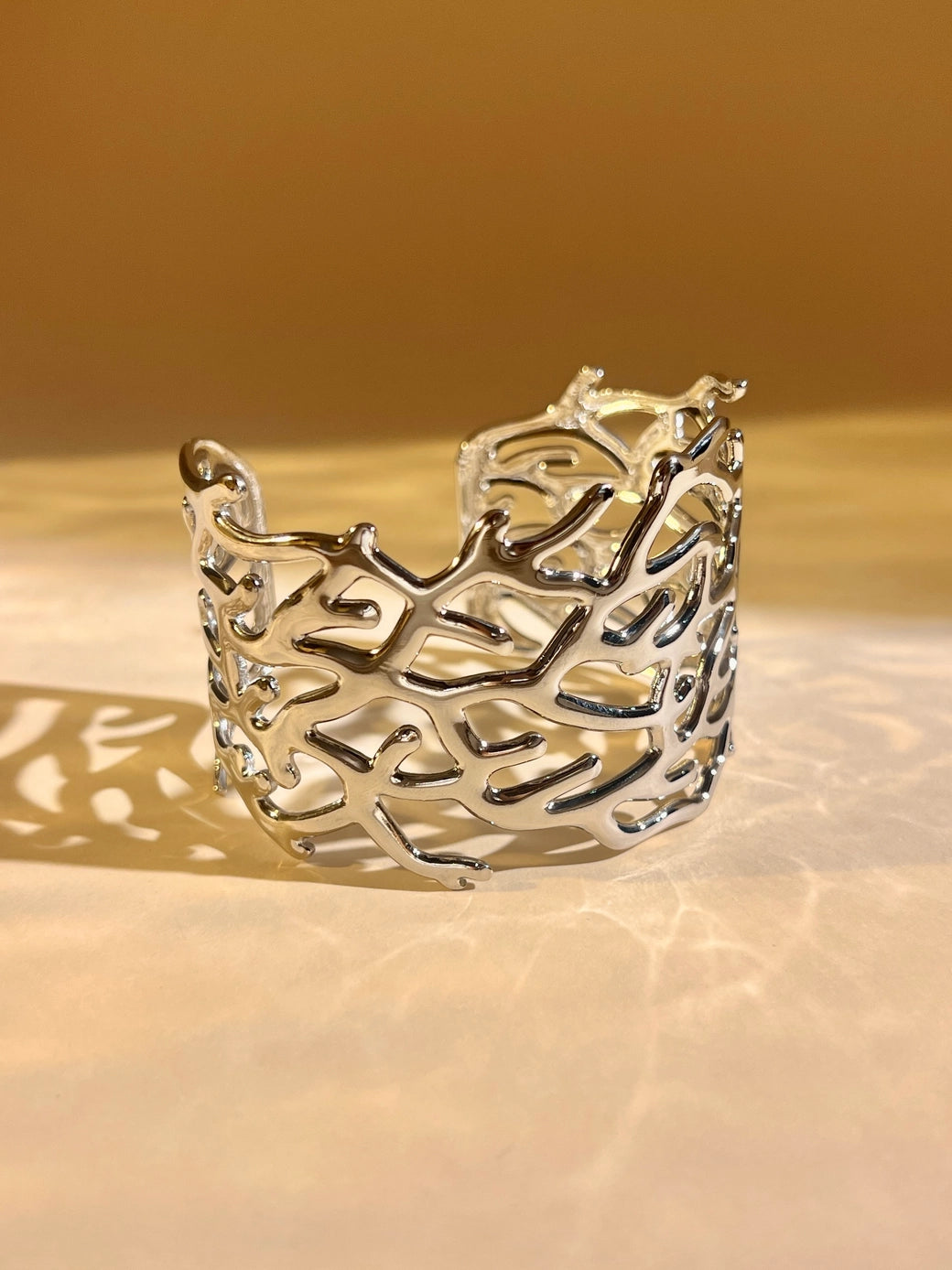 Silver Openwork Cuff Bracelet – Chic Coral Design, Steel